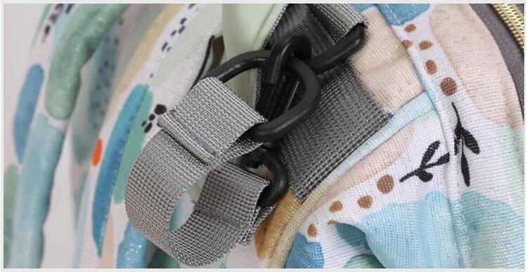 Bolso de pa&ntilde;al de mochila con gancho de cochecito